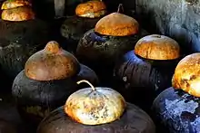 Traditional burnay jars containing fermenting bagoong in Ilocos Norte