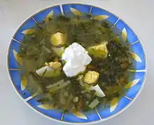 Green borscht with egg and sour cream