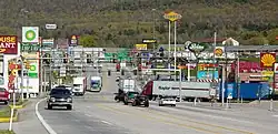 The stretch of U.S. Route 30 in Breezewood, Pennsylvania is one of the few gaps in the Interstate Highway System. A portion of I-70  uses this surface street to connect the untolled interstate highway with the Pennsylvania Turnpike.