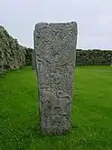 A replica of the Pictish Bressay Stone in St Mary's churchyard where the original stone was found.