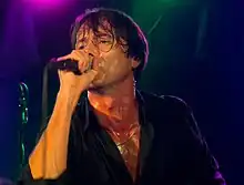 Anderson on stage with Suede in Manchester (2011)