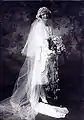 Short wedding dress with long train attached. 1920s