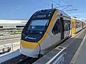 A Queensland Rail NGR train at Domestic Terminal