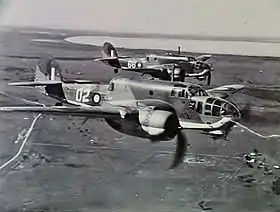 Two twin-engined military aircraft in flight