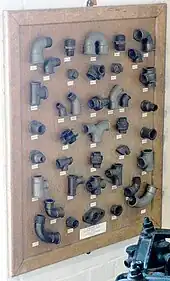 Plumbing fittings on a board