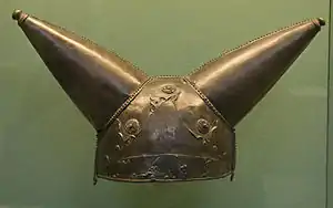 Bronze helmet with two conical horns