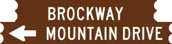 A graphic representation of the brown wooden sign for Brockway Mountain Drive