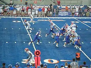 A play during a game between Boise State and Louisiana Tech on Bronco Stadium's blue-colored artificial turf