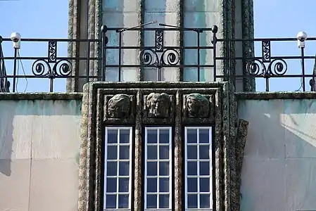 Detail of the facade, made of reinforced concrete covered with marble plaques