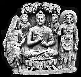 A seated Buddha triad from Sahr-i-Bahlol, similar to the Brussels Buddha, possibly dated to 132 CE. Peshawar Museum.