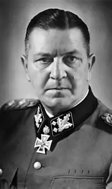 a black and white photograph of Theodor Eicke in SS dress uniform