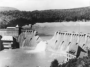 a damaged concrete dam