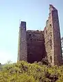 Bergfried of a ministerial castle in the Bishopric of Kempten: the two-part, residential main tower of Vilsegg Castle, Tyrol, Austria. The beam holes show where the former floors were