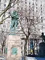 View from western side of the square. Tribute to Robert Burns in the foreground, Boer War Memorial in behind and the Sun Life Building in the background