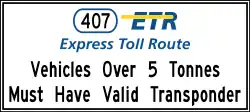 "Vehicles Over 5 Tonnes Must Have Valid Transponder" sign, located before entrance ramps to hwy. 407, also known as the ETR.