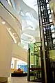 Charles Perkins Centre interior atrium showing the glass elevator