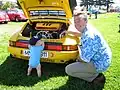 A view of the  Ruf CTR engine bay of the CTR with Alois Ruf present near the car