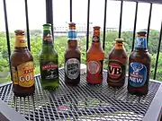 Six stubbies of different Australian beers.