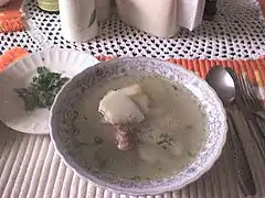 A caldo de costilla served hot and with cilantro leaves