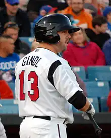 A baseball player in white