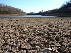 A dry lakebed in California, which is experiencing its worst megadrought in 1,200 years..mw-parser-output cite.citation{font-style:inherit;word-wrap:break-word}.mw-parser-output .citation q{quotes:"\"""\"""'""'"}.mw-parser-output .citation:target{background-color:rgba(0,127,255,0.133)}.mw-parser-output .id-lock-free.id-lock-free a{background:url("//upload.wikimedia.org/wikipedia/commons/6/65/Lock-green.svg")right 0.1em center/9px no-repeat}body:not(.skin-timeless):not(.skin-minerva) .mw-parser-output .id-lock-free a{background-size:contain}.mw-parser-output .id-lock-limited.id-lock-limited a,.mw-parser-output .id-lock-registration.id-lock-registration a{background:url("//upload.wikimedia.org/wikipedia/commons/d/d6/Lock-gray-alt-2.svg")right 0.1em center/9px no-repeat}body:not(.skin-timeless):not(.skin-minerva) .mw-parser-output .id-lock-limited a,body:not(.skin-timeless):not(.skin-minerva) .mw-parser-output .id-lock-registration a{background-size:contain}.mw-parser-output .id-lock-subscription.id-lock-subscription a{background:url("//upload.wikimedia.org/wikipedia/commons/a/aa/Lock-red-alt-2.svg")right 0.1em center/9px no-repeat}body:not(.skin-timeless):not(.skin-minerva) .mw-parser-output .id-lock-subscription a{background-size:contain}.mw-parser-output .cs1-ws-icon a{background:url("//upload.wikimedia.org/wikipedia/commons/4/4c/Wikisource-logo.svg")right 0.1em center/12px no-repeat}body:not(.skin-timeless):not(.skin-minerva) .mw-parser-output .cs1-ws-icon a{background-size:contain}.mw-parser-output .cs1-code{color:inherit;background:inherit;border:none;padding:inherit}.mw-parser-output .cs1-hidden-error{display:none;color:#d33}.mw-parser-output .cs1-visible-error{color:#d33}.mw-parser-output .cs1-maint{display:none;color:#2C882D;margin-left:0.3em}.mw-parser-output .cs1-format{font-size:95%}.mw-parser-output .cs1-kern-left{padding-left:0.2em}.mw-parser-output .cs1-kern-right{padding-right:0.2em}.mw-parser-output .citation .mw-selflink{font-weight:inherit}html.skin-theme-clientpref-night .mw-parser-output .cs1-maint{color:#18911F}html.skin-theme-clientpref-night .mw-parser-output .cs1-visible-error,html.skin-theme-clientpref-night .mw-parser-output .cs1-hidden-error{color:#f8a397}@media(prefers-color-scheme:dark){html.skin-theme-clientpref-os .mw-parser-output .cs1-visible-error,html.skin-theme-clientpref-os .mw-parser-output .cs1-hidden-error{color:#f8a397}html.skin-theme-clientpref-os .mw-parser-output .cs1-maint{color:#18911F}}Ivanova, Irina (June 2, 2022). "California is rationing water amid its worst drought in 1,200 years". CBS News.