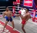 Intercepting a kick in Cambodian boxing match