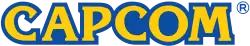 The name “Capcom” spelled out in yellow, with the letters surrounded by a blue outline.