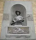 Close up picture of the Selous Memorial in the wall in the main hall of the Natural History Museum