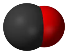 A large black spherical object with a slightly smaller red one merging into it from the right