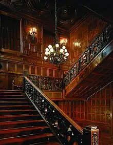 A view of the house's grand staircase, which is made of imported Scottish oak