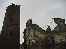 Damaged tower and destroyed Baroque palace,  before renovation