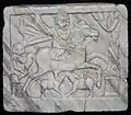 Thracian horseman with hounds, a serpent-entwined tree and a footman (3rd century), Constanța History and Archaeology Museum