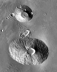 2001 Mars Odyssey THEMIS mosaic of Ceraunius Tholus (lower volcano) and Uranius Tholus (upper volcano).  Ceraunius Tholus is about as high as Earth's Mount Everest.