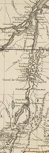 The map is oriented with north to the top. The lower section of the map shows Saratoga, New York and Fort Edward, on the Hudson River.  Red markers depict the position of John Burgoyne's army near Saratoga at the time of its surrender in 1777. A line of mountains is shown to the right of the Hudson, extending northward but eventually bending off the map to the east.  North of Fort Edward are Fort George, at the southern end of Lake George, and Skenesborough, near the southern end of Lake Champlain.  About one third of the way up the map,  Lake George joins with Champlain, and Fort Ticonderoga is shown at the northwest side of the junction.  Lake Champlain extends to the north and is dotted with islands.  There is a red line marking the boundary between New York and Quebec, and the upper third of the map shows the Richelieu River extending north to meet the Saint Lawrence River at Sorel, with Montreal southwest of that point.