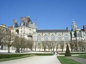 The "Golden Gate" portal to the oval courtyard (left) and Saturnin Chapel (right), rebuilt with new facade by Henry IV