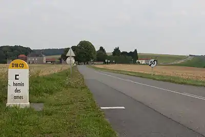 Photograph shows Route D18 CD on the Chemin des Dames with Heurtebise Farm at left.