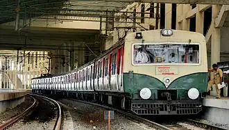 A local train at Velachery railway station in the MRTS line heading toward  Chennai Beach.