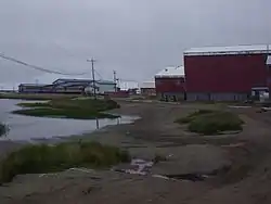 The school (blue), lake, and condemned old school (red)