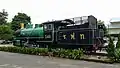 Steam locomotive on display in front of the station