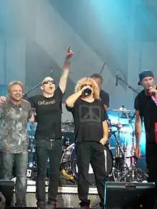 Live at the Bospop festival, 2009.  Left to right: Michael Anthony, Joe Satriani, Sammy Hagar, Chad Smith.