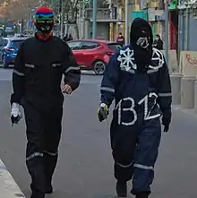 Chilean insurrectionary anarchists wearing the Chaos star symbol