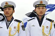 Sailors of the Chinese People's Liberation Army Navy, wearing a striped shirt similar to the Telnyashka.