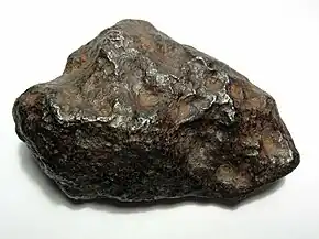 A 700-gram (25 oz) individual Chinga iron meteorite (Ataxite, class IVB). This specimen is about 9 centimeters wide.