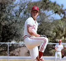 A baseball player in white