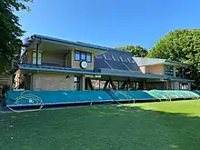 A colour photograph of a cricket pavilion