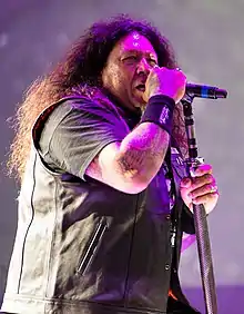 Billy performing with Testament in 2014