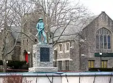 northeast at statue and Community Church of the Circle in Mt. Vernon on a cloudy afternoon