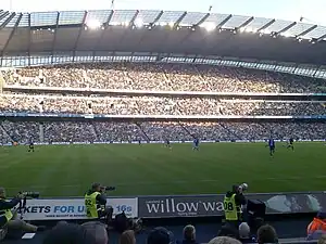 Manchester City fans watch Manchester City play Birmingham City at Eastlands