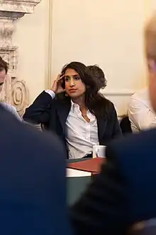 A woman at a meeting table