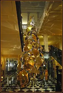 Christmas tree by Bailey for Claridge's, with over 100 umbrellas covered in gold and silver metallic fabric